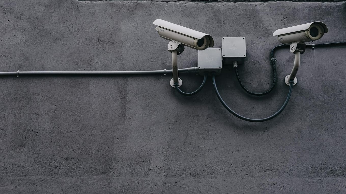 two gray bullet security cameras
